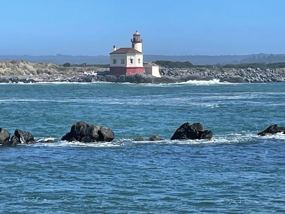 After procuring our cookies, we drive out to the Bandon South Jetty Park which has a very nice overlook of the Coquille River and the lighthouse across the river entrance from the ocean