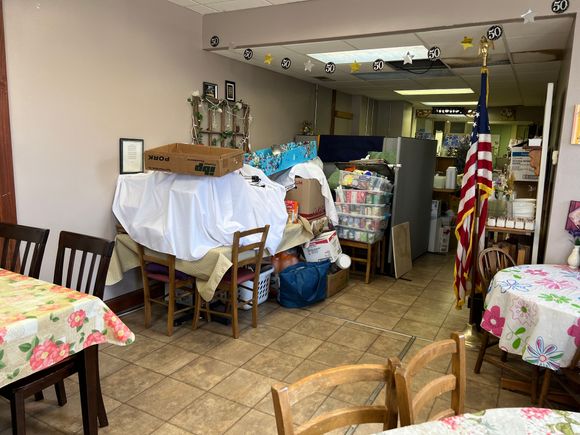 So, I have a weakness for small businesses. And start up businesses. And mom and pop restaurants. In Winterset Iowa we were looking for food. While walking around their sidewalk sign seemed to fit the weaknesses perfectly.  This is the decor were were greeted with. 6 tables, a 'path' to the restroom and kitchen and this decor. The food was excellent but the waiter was scary.