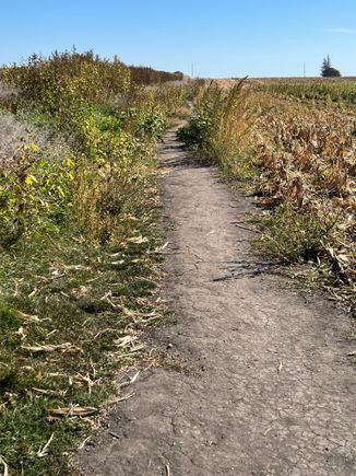 The farmer that owns the field has donated the space for the trail to the crash site. It's about 1/4 mile off the road.