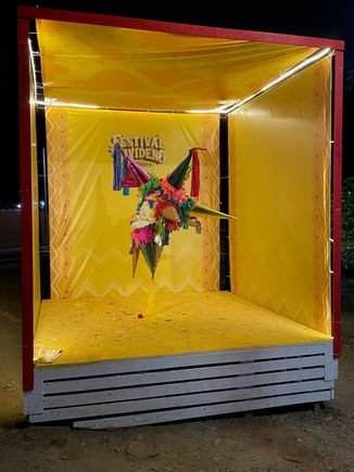 A big box with a decorative pinata. Another photo opp!