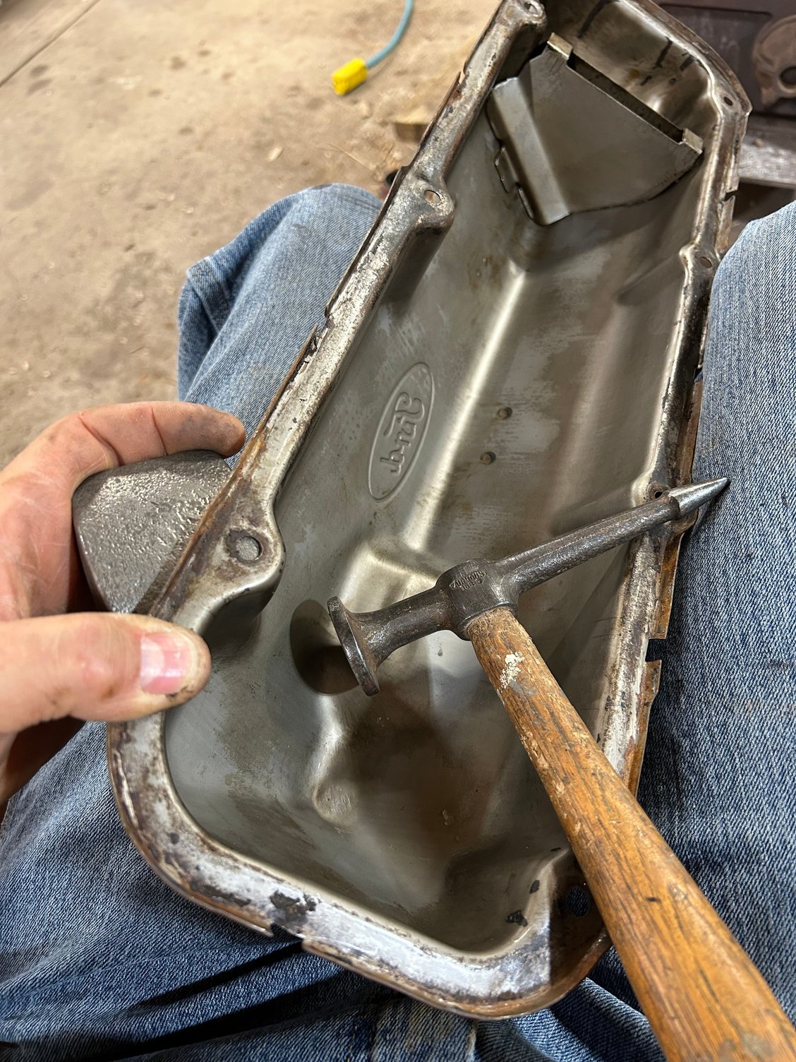 There were a few small dents in the passenger side valve cover. I wanted to get knocked out a little bit, and then I went around, straightening all The bolt holes and making sure the lip edge was straight. There was a few bent edges.