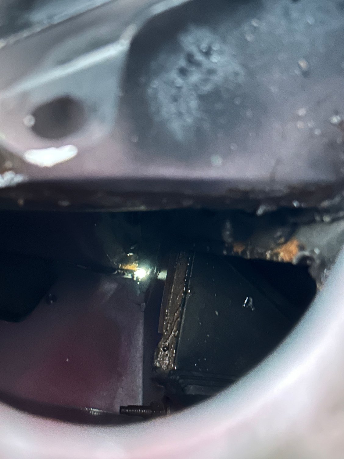 Flashlight from inside driver side looking down hood cowl (removed)