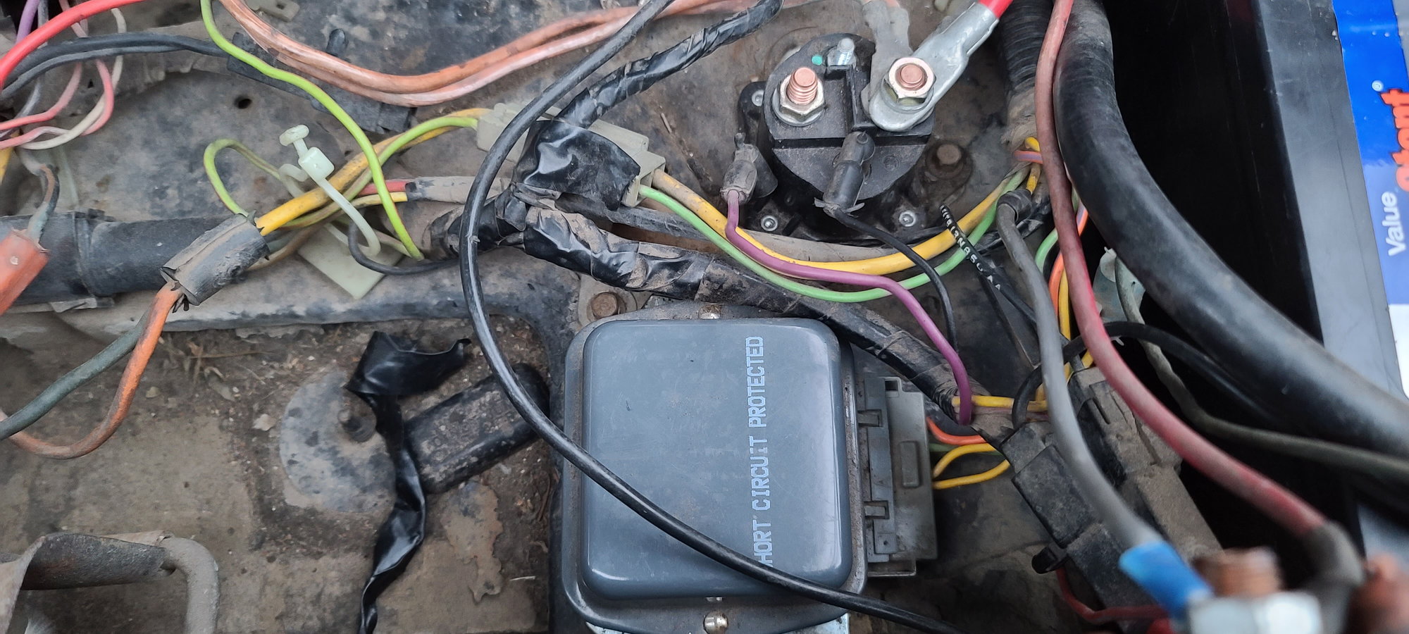 which connector do i unhook first on a car battery