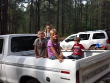 Same camping trip being used as a jungle gym, my daughter was the only girl and I think she was probably the toughest one there. Oh by the way she did help daddy put the engine in and work on it.