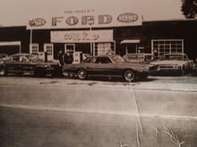 This is our local ford dealership 1968.  The 68 1/2 Mustang Cobra Jet race car is still around, but has not seen the light of day in years.