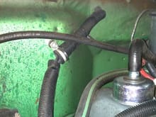 Behind the engine is a possible second spot for another hole.  It is in a very warm area.  This is the stock location of the heater cable, but there is room for other wires.  A grommet, enlargement, o