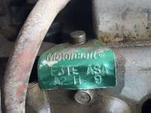 Here is a close up of the tag on the carb on my truck.  I believe  that this carb doesn't belong on this truck as I haven't been able to find it on the Internet when searching for 1980 F-150 300 in-line 6.  As far as I can find, there should be nothing electric on the carb on my truck other than the choke.