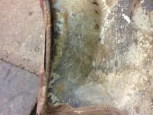 Detail showing the edge of the sheet metal rolled around the rod and then welde in spots.