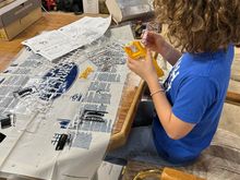 Helped my middle boy get set up real quick and got him situated to where he could continue working on his model. And then just as I was getting ready to knock some freeze plugs out my oldest boy came out, so I handed him the punch and hammer and made him do it. And I showed him how to knock him sideways so that we could pull them out with a pair of pliers