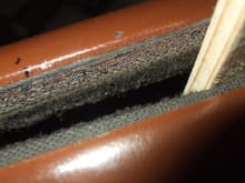 I used small strips of wood molding to hold felts in place while adhesive cures.