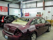 Sable in the body shop. The damage came to more than $6900. The back window was broken out and the deck lid spoiler was crushed. The roof panel was so rippled that they replaced it entirely.