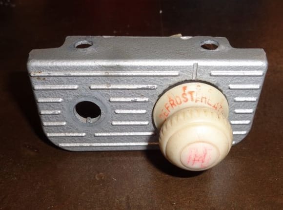 The original heater control bracket.