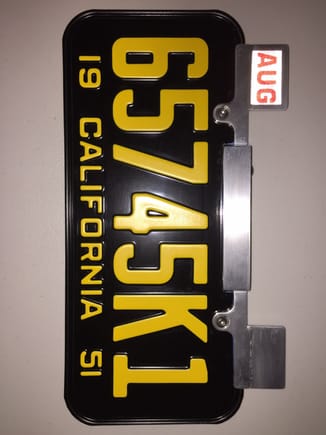 cut up an old license plate frame to install my new "old" plate.  The old plates are wider.