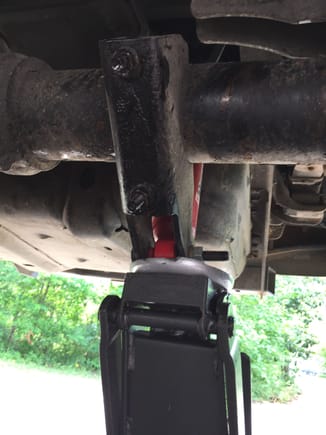 I used a floor jack to hold the shock mounts in place while replacing the U-bolts. Worked like a charm on the passenger side. Had to maneuver the mount down a bit to get the U-bolt out on the drivers side. Was a pain getting things raised back up and realigned. Never had to drop the passenger side one.