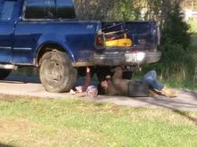 Granddaughter helping me install lights under tailgate above bumper.
