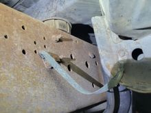 Corrosion on the frame to body ground.