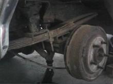I think I need to replace these... notice how it's a "4-pack" in the front, and just after the axle it's a "2-pack". Threw the Last Straw spring driving it up on ramps to work on the exhaust. Took two days (and finally the cutting torch!) to remove one side. Oh how I hate rust. Also note in picture: the "pristine" (read: disintegrating) drum.