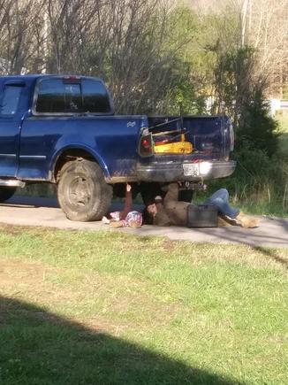 Granddaughter helping me install lights under tailgate above bumper.
