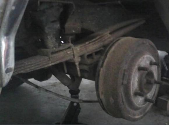 I think I need to replace these... notice how it's a "4-pack" in the front, and just after the axle it's a "2-pack". Threw the Last Straw spring driving it up on ramps to work on the exhaust. Took two days (and finally the cutting torch!) to remove one side. Oh how I hate rust. Also note in picture: the "pristine" (read: disintegrating) drum.