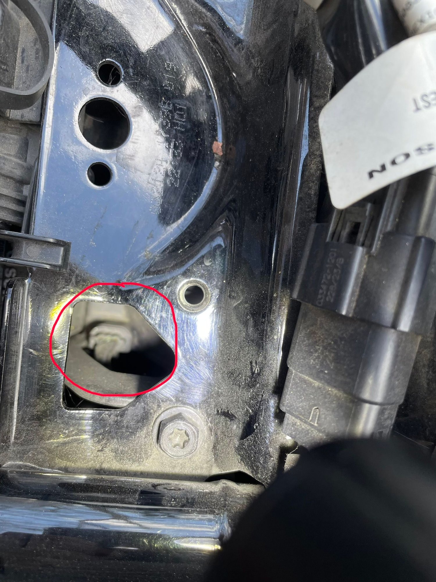 View from above, seat removed, left side of the bike, down in tha cavity.