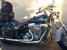 2000  FXST  Rear suspension lowered 1 1/2", 16" fat boy Aluminum Rims - Tires F & R   LePera seat,  Lowered Fat Boy F Fender (now painted matching Sinister Blue)  HD Drag Bars..  More, cant remember the names...