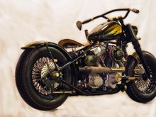 This is a bike from a local builder called the Brass Hopper.  It was in Easy rider a couple years ago.