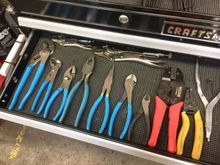 Channellock pliers, vise grips, sk wire strippers, matco crimped tool which is awesome! And the silver snap ring pliers are for working on exhaust pipes. There’s a snap ring that holds flanges on where the header pipe attaches to the exhaust studs on the head.