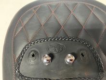 Close up if pillion, bib and nuts.