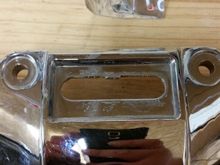 The little plate is just glued on and pops right off.