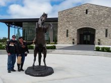 Suzie and I outside of the winery next to the dark horse for after which the winery is named.