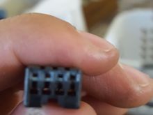 Oh and no writing on it at all. The end of it. 2 holes stacked on eachother. There is 4 slots for wire but this one omly has 3 wires in it