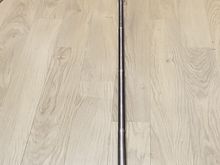 The pole is so long I couldn't get it all in the picture w/o going outside. It is 1/2 circumference at the top section