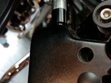 The black piece between the perch and the cable ferrule is black anodized aluminum. It's not plastic, although it wouldn't bother me if it was. It's in compression, can't imagine it breaking.