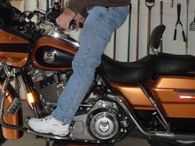 Both feet normal position on floorboards, really have to hold myself forward