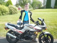Son with his Kawasaki Ninja 500 a few years ago after the Ninja 250 he learned on for street riding.  He now rides the Suzuki DL650.