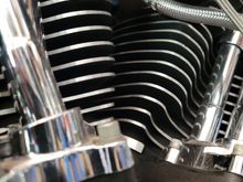 smaller line is oil pressure they meet up and head our together