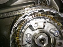 Slide all the plates out. You can see the damper spring an final plate.