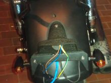 Lucas tail light bracket and turn signals are on.