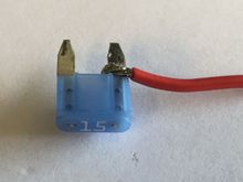 Wire solder close as possible to the plastic part of the Accessory 15A fuse.