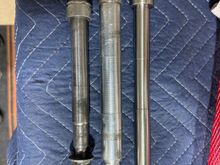 Stock FXD axle on left, Stock 49mm axle in middle, and the Vulcan conversion axle on the right. Definitely going to need some spacers. 