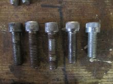 I think the one in the middle with the stripe going through the knurl is OEM, & the one on the right, stamped "H-D" but maybe not from the Shovelhead era . . .