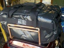 Sown with a different "waterproof" bag sitting on it before the straps were added.  That bag failed the water test miserably the first time we used it, so we sent it back.