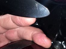 The top black thing is the fairing vent, at full right lock.  The other finger is at the tip of the wing, sitting on the lower.
