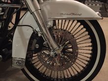 21x3.5 DNA Mammoth Diamond Spokes. Did front and rear (not doing rear looks hokey to me, especially if the wheels are very different in appearance). 

Progressive Monotubes in front with 1" lowering to get back to stock ride height. Bike rides awesome!