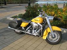 painted side cover lower half BLACK, HD oil cooler, added. flamed cover package. stock foot brake, I just hand drilled holes for custom look.