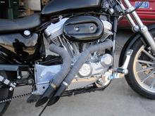 Straight on shot of staggered exhaust and forward controls