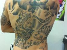 Right before we got started on my last sitting.  The cover-up is mostly complete on that small tattoo on my upper back now.