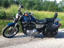 This is my 2001 Sportster 883 Hugger.  Real Teal Pearl.  I bought it new.  Mostly stock, I chromed it out over the years and blacked out the engine myself.