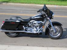 My newest addition. 2006 Street Glide. I love this bike so much, I want to take it behind the garage and get it pregnant.