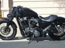 '09 Harley Nightster with relocated speedometer, flat-black powdercoated primary cover w/Willie G. dirby cover, Lick's Solo-Bag.